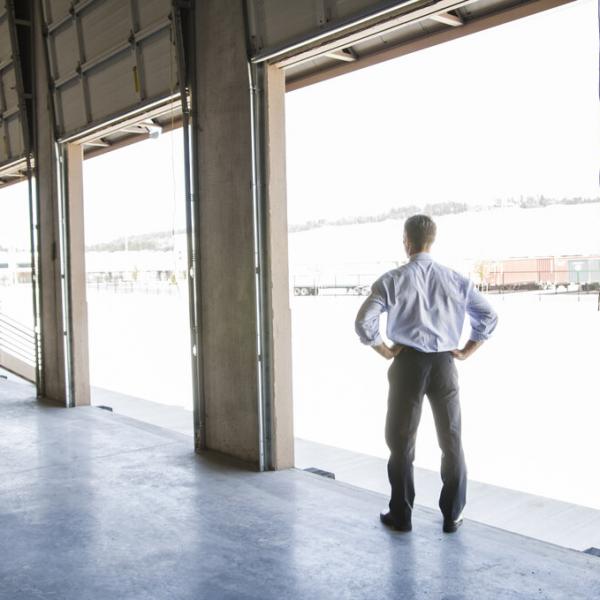 Man standing in loading dock.